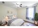 Cozy bedroom with neutral decor, a plush rug, and ample natural light at 6510 Newcastle Way, Cumming, GA 30040
