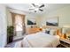 Comfortable bedroom with neutral decor, wood flooring and large windows at 6510 Newcastle Way, Cumming, GA 30040