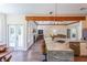Open kitchen with a bar top and views into a living area and a patio at 6510 Newcastle Way, Cumming, GA 30040