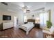 Spacious primary bedroom with hardwood floors, recessed ceilings and ensuite bathroom at 6510 Newcastle Way, Cumming, GA 30040