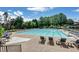 Large outdoor swimming pool with lounge chairs and seating area at 6510 Newcastle Way, Cumming, GA 30040