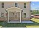 Exterior view of a patio with brick accents and a ceiling fan at 6944 Melody Ridge Rd, Buford, GA 30518