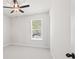 Bedroom featuring neutral walls, white trim, and a ceiling fan at 6944 Melody Ridge Rd, Buford, GA 30518