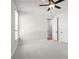 Bright bedroom with neutral walls, white trim, and two doors at 6944 Melody Ridge Rd, Buford, GA 30518