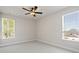 Bedroom with a ceiling fan and two large windows at 6944 Melody Ridge Rd, Buford, GA 30518