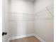 Walk-in closet with wood flooring and white wire shelving at 6944 Melody Ridge Rd, Buford, GA 30518