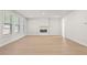 Bright and airy living room with a cozy fireplace and large windows at 6944 Melody Ridge Rd, Buford, GA 30518