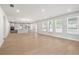 Bright, open living area with a kitchen, fireplace, and backyard access at 6944 Melody Ridge Rd, Buford, GA 30518