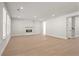 Bright and airy living room with a cozy fireplace and large windows at 6944 Melody Ridge Rd, Buford, GA 30518