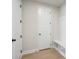 Functional mudroom with built-in bench, storage cubbies, and light hardwood floors for easy organization at 6944 Melody Ridge Rd, Buford, GA 30518