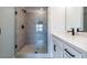 Modern bathroom highlighting a glass shower and white vanity, creating a spa-like retreat with contemporary design at 4810 Floydwood Ln, Mableton, GA 30126
