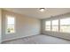 Bright bedroom with neutral carpet and multiple windows, creating a serene and inviting space at 4810 Floydwood Ln, Mableton, GA 30126