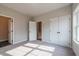 Spacious bedroom with closet, neutral carpet and an open door to the stairs at 4810 Floydwood Ln, Mableton, GA 30126