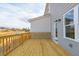 New wood deck with gray siding offers a relaxing outdoor living space at 4810 Floydwood Ln, Mableton, GA 30126