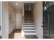 Light-filled foyer with hardwood flooring and a staircase leading to the upper level at 4810 Floydwood Ln, Mableton, GA 30126