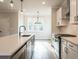 Modern kitchen features white cabinets, stainless appliances, and a large kitchen island at 4810 Floydwood Ln, Mableton, GA 30126