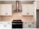 Close-up of a well-equipped kitchen featuring stainless steel appliances and white cabinetry, offering a clean and modern cooking space at 4810 Floydwood Ln, Mableton, GA 30126
