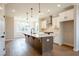 Bright kitchen features a large island with pendant lighting, stainless appliances, and sleek cabinetry for a modern feel at 4810 Floydwood Ln, Mableton, GA 30126