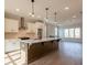 Gourmet kitchen features white cabinets, a large island, and stainless steel appliances at 4810 Floydwood Ln, Mableton, GA 30126