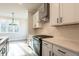 Kitchen features stainless appliances, white countertops and cabinets, and access to the breakfast room at 4810 Floydwood Ln, Mableton, GA 30126