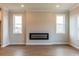 Comfortable living area with modern fireplace, hardwood floors, and bright windows at 4810 Floydwood Ln, Mableton, GA 30126