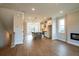 Open-concept living space with hardwood floors, island, and view of the kitchen at 4810 Floydwood Ln, Mableton, GA 30126
