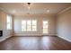 Bright living room features wood floors, a large window and door to the outside at 4810 Floydwood Ln, Mableton, GA 30126