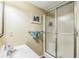 Cozy bathroom featuring a sink and shower with sliding glass doors at 7310 Ne Wynhill Ne Dr, Atlanta, GA 30328