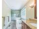 Bright bathroom with a soaking tub, tiled shower and granite vanity countertop at 7310 Ne Wynhill Ne Dr, Atlanta, GA 30328