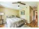 Comfortable bedroom with hardwood floors, ceiling fan, and neutral decor, providing a relaxing and inviting space at 7310 Ne Wynhill Ne Dr, Atlanta, GA 30328