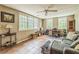 Bonus room featuring tile floors, natural light, and home office setup with a cozy sofa at 7310 Ne Wynhill Ne Dr, Atlanta, GA 30328
