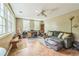Versatile bonus room with tile flooring, ample natural light, and comfortable seating area at 7310 Ne Wynhill Ne Dr, Atlanta, GA 30328