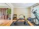 Bright exercise room featuring hardwood floors, natural light, and modern equipment at 7310 Ne Wynhill Ne Dr, Atlanta, GA 30328