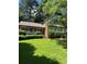 Charming two-story home featuring a lush green lawn, landscaped yard, and inviting front porch at 7310 Ne Wynhill Ne Dr, Atlanta, GA 30328
