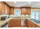 Well-equipped kitchen featuring granite countertops, wooden cabinets, and stainless steel appliances at 7310 Ne Wynhill Ne Dr, Atlanta, GA 30328