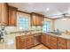 Charming kitchen with stainless steel appliances, granite countertops, and wooden cabinets at 7310 Ne Wynhill Ne Dr, Atlanta, GA 30328