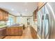 Spacious kitchen with stainless steel appliances, wood cabinets, and a view into the living room at 7310 Ne Wynhill Ne Dr, Atlanta, GA 30328