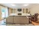 Cozy living room with built-in bookshelves surrounding a fireplace and french doors to the backyard at 7310 Ne Wynhill Ne Dr, Atlanta, GA 30328