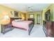 Inviting main bedroom with plush carpeting, a king-sized bed, and soft, natural light at 7310 Ne Wynhill Ne Dr, Atlanta, GA 30328