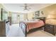 Spacious main bedroom featuring a king-sized bed, TV, and ample natural light at 7310 Ne Wynhill Ne Dr, Atlanta, GA 30328