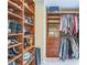 Custom closet with wooden shelving and ample storage space for clothes, shoes, and accessories at 7310 Ne Wynhill Ne Dr, Atlanta, GA 30328