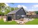 Spacious backyard with a patio, dining set, lush lawn, and privacy fencing at 2407 Boulder Se Rd, Atlanta, GA 30316