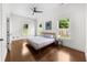 Bright and airy bedroom with hardwood floors, a modern ceiling fan, and sunny windows at 2407 Boulder Se Rd, Atlanta, GA 30316