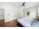 Spacious bedroom with hardwood floors, neutral walls, ceiling fan, and bright windows at 2407 Boulder Se Rd, Atlanta, GA 30316