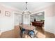 Bright dining room features hardwood floors, millwork, and view to living area at 2407 Boulder Se Rd, Atlanta, GA 30316