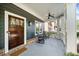 Charming covered front porch with rocking chairs and craftsman details at 2407 Boulder Se Rd, Atlanta, GA 30316