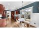 Eat-in kitchen features stainless appliances, wooden floors, and a bright window overlooking the backyard at 2407 Boulder Se Rd, Atlanta, GA 30316