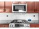 Modern stainless steel oven and microwave in a kitchen with ample cabinet space and white subway tile backsplash at 2407 Boulder Se Rd, Atlanta, GA 30316