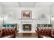 Bright living room features fireplace, hardwood floors, and natural light from two windows at 2407 Boulder Se Rd, Atlanta, GA 30316