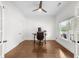 Bright home office with hardwood floors, ceiling fan, and natural light from the large windows at 2407 Boulder Se Rd, Atlanta, GA 30316